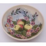 A Moorcroft pottery bowl in the 'Temptations' pattern after Sally Tuffin, decorated with peaches and