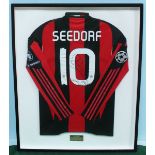 An AC Milan 'Number 10' football shirt, worn and signed by Clarence Seedorf, the sleeves with