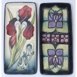 Two various Moorcroft pottery rectangular pen trays, one decorated in the 'Violets' pattern after '