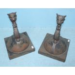 A pair of late 19th century cast iron finials, with 31.5cm square base capped with foliate scroll