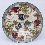 A Moorcroft pottery Year plate '1998' decorated with blackberries in the 'Summers End' pattern,