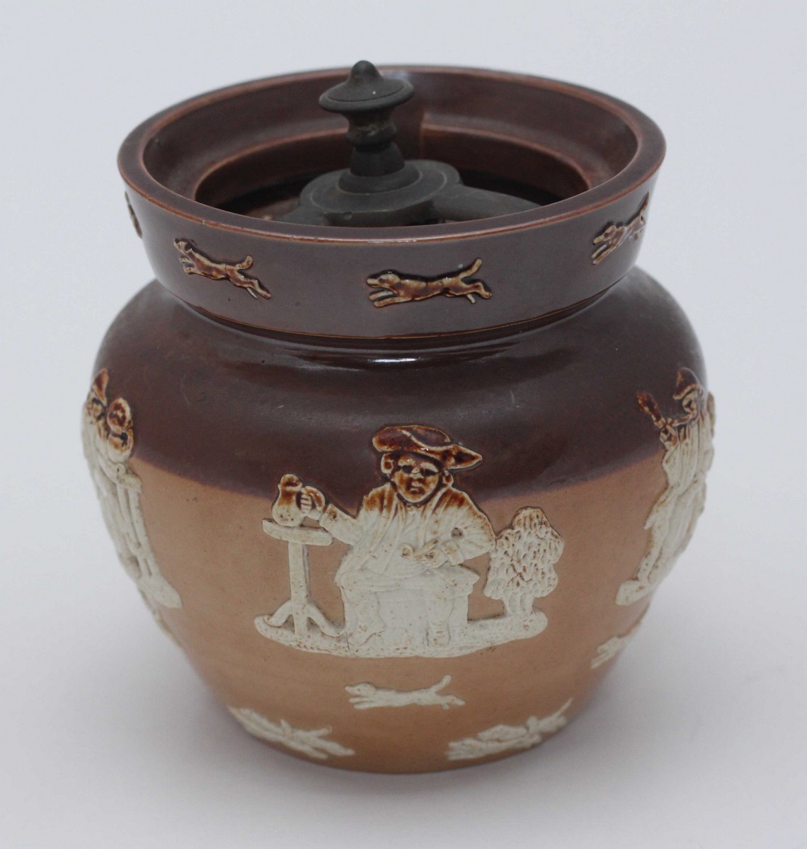 A large Royal Doulton Tobacco Jar, with cover, decorated in a 'Harvest' pattern with seated men