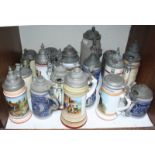 SECTION 8. A collection of 18 assorted pewter-lidded pottery and glass drinking steins, some