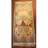 A small hand-knotted runner, the symmetrical design with flowers and geometric shapes to a blue