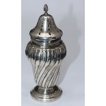 A late Victorian silver caster by Charles Westwood & Sons, with spiral-twisted body to splayed