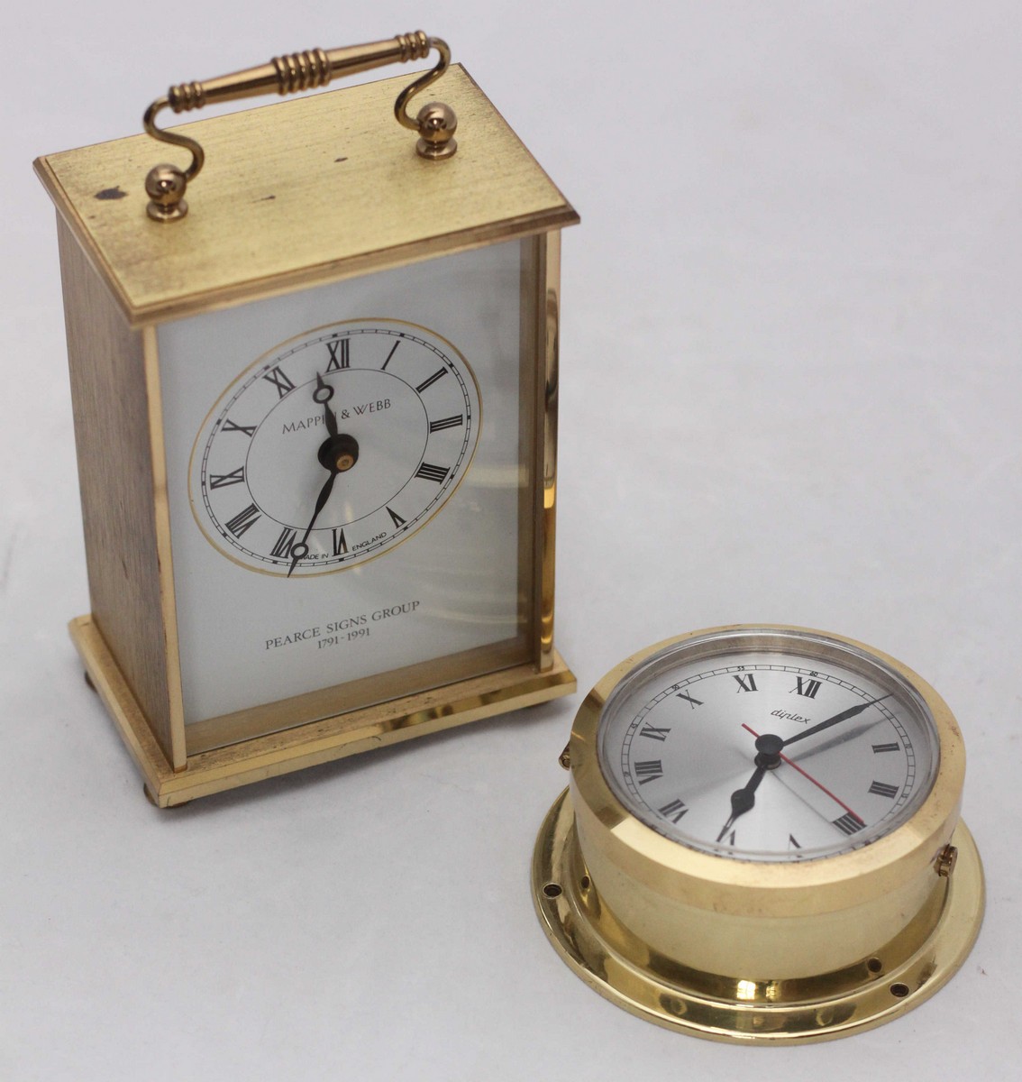 A Mappin & Webb quartz mantel clock, engraved to the reverse and also marked 'Pearce Signs Group