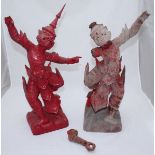 A pair of Eastern carved wood mythological dancing Buddhist figures, stained red, as found,