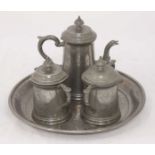 A Huikee Swatow four-piece pewter tea set with engraved dragon decoration, comprising a teapot,