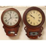 Two Victorian drop dial wall clocks, both with Roman numerals and small glazed doors below, the