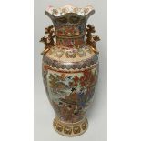 A large ornate Chinese pottery vase of inverted baluster form, with gilded decoration and the