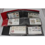 A collection of approximately 230 assorted first day covers across three albums.