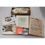 A collection of assorted unused world stamps across two albums, one with ERII definitives, some