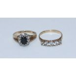 Two various 9ct gold rings including one claw set with a sapphire surrounded by small