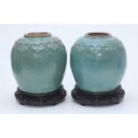 A Pair of Chinese Celadon Ginger Jars, each with a band of carved cloud scrolls around the