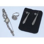 A ladies silver and marcasite cocktail watch together with a pair of marcasite drop-earrings and