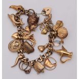 A 9ct gold charm bracelet with nineteen charms, gross weight approximately 41.23g