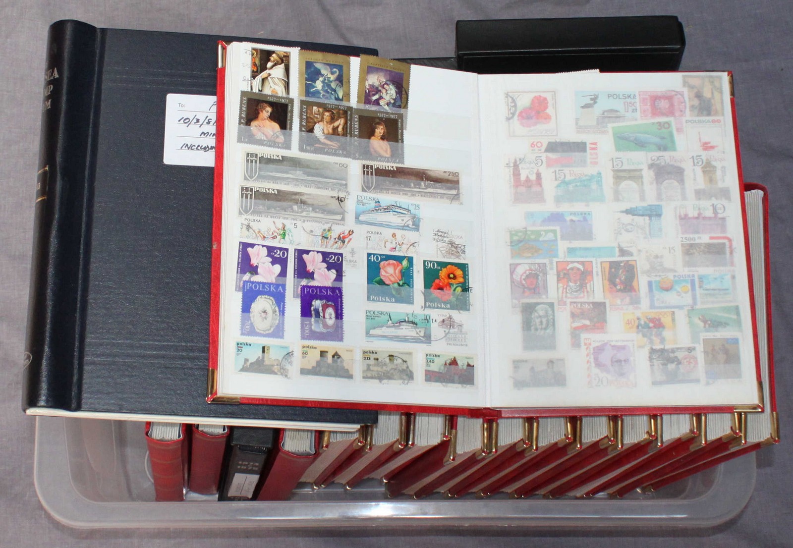 A collection of Polish stamps, mid 20th century onwards, used and in fifteen 26x20cm red vinyl stock