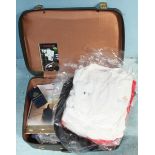 A suitcase containing a collection of Queen Elizabeth II (QEII) Cunard ephemera including menus, t-