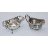 A silver cream jug, London 1809?, maker's marks rubbed, together with a silver sauce boat,