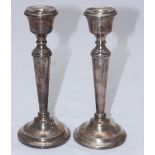 A pair of silver candlesticks by A T Cannon Ltd, hallmarked Birmingham, 1968. 21cm high.