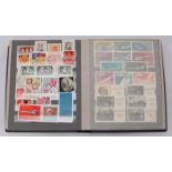 A collection of assorted Russian stamps, loose mounted in stock book, largely unused.