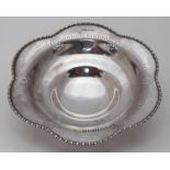 A silver lobed circular dish with pierced decoration to the border, engraved inscription, Chester,