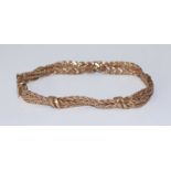 A 9ct gold bracelet, of double row twist-plait design with interspersed links and safety catch,