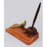 A Carlton Ware pen holder and stand modelled with an exotic bird and lustre decoration, 18cm wide