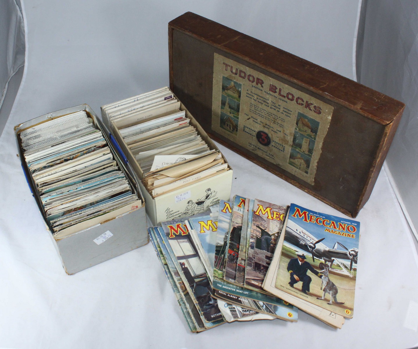 Two boxes of assorted postcards including local scenes, together with a wooden box containing