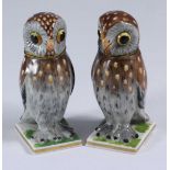 A pair of French porcelain novelty inkwells modelled as owls painted with polychrome enamels, 8cm