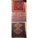 Three various hand-knotted Caucasian rugs, the largest 153x96cm (3)