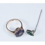 A 9ct gold ring centrally claw set with a synthetic Alexandrite, together with a silver pin brooch