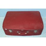 A large vintage deep red Antler suitcase with striped lined interior, with keys, approx. 73cm wide