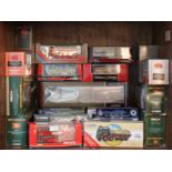 A collection of 50 assorted boxed scale model transport vehicles, predominantly buses, including