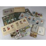A collection of assorted loose cigarette and cards and some in album, including sets of 'Modern