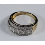 A 9ct gold five-row wide band ring set with princess-cut diamonds to the centre row and with