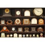 A collection of 26 assorted clocks including oak cased mantel clocks, a black-forest style wall