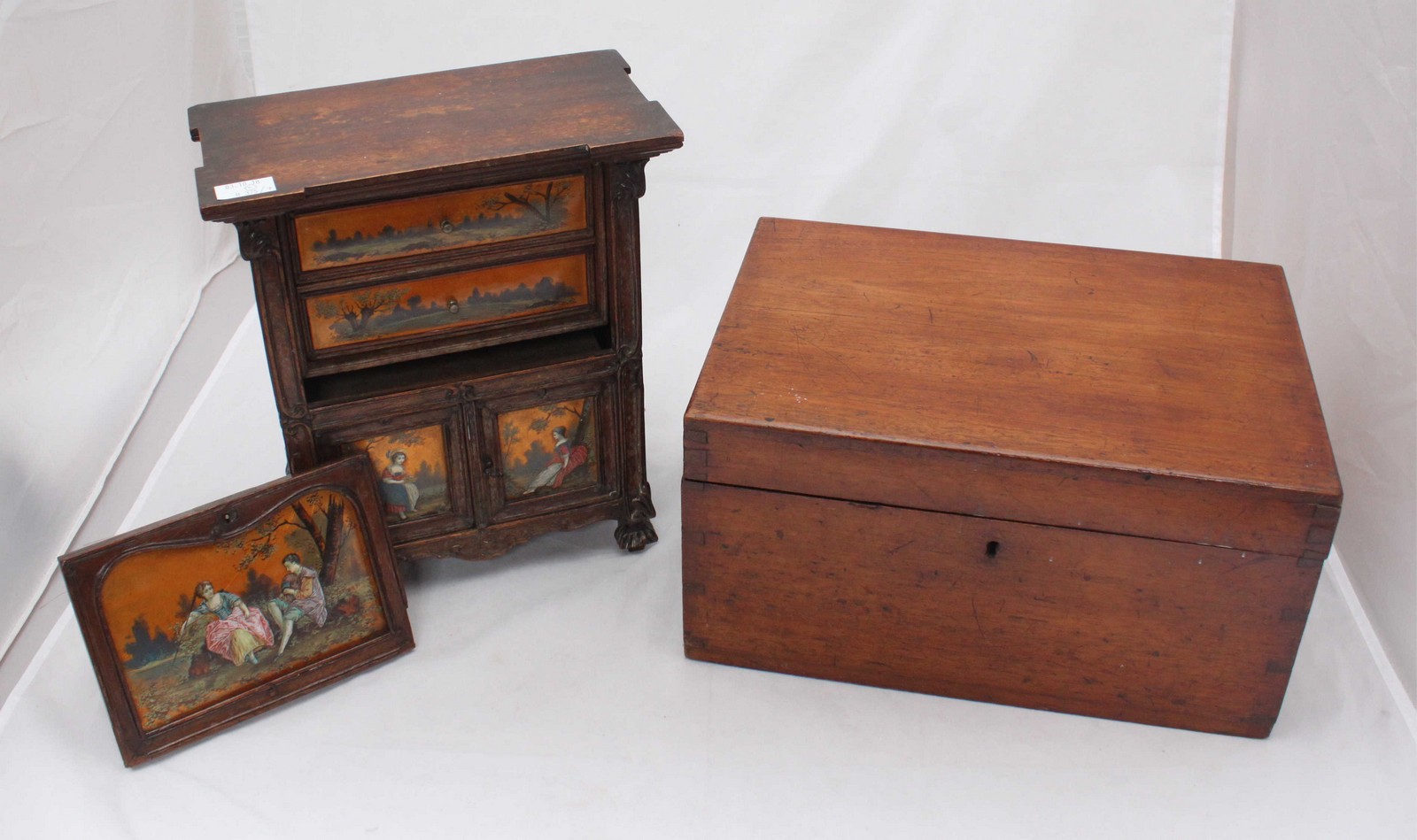 An antique ladies jewellery box modelled as a miniature cabinet, with panels painted with scenes