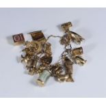 A 9ct gold charm bracelet, with numerous assorted 9ct gold charms including a lantern, a scroll