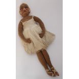 A scarce 1920s Ballerina rag doll with stuffed suede body and suede covered papier-mâché head,