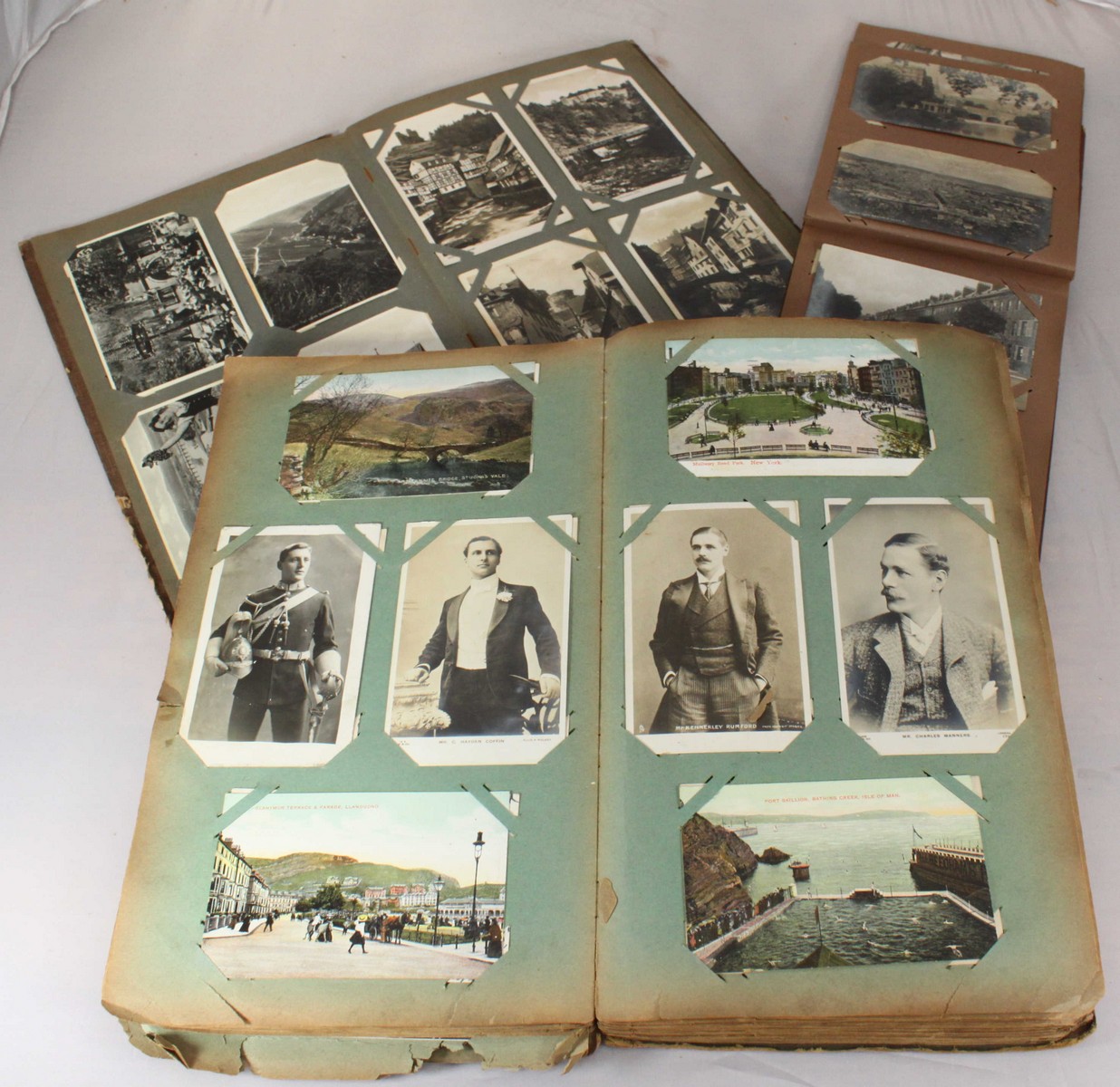 A collection of approximately 600 assorted postcards across three albums, of varying subject matter,