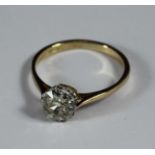 An 18ct gold solitaire diamond ring, eight double claw-set with a round brilliant cut diamond. The