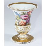 An early 19th century porcelain vase of classical form with beaded rim and footrim, in the style