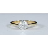 An 18ct gold solitaire diamond ring, eight claw-set with a round brilliant-cut diamond. The