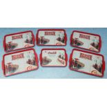 Five large advertising trays 'Coca-Cola 5c at fountains - in bottles 5c' and a smaller similar