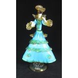 A large Venetian glass figure of lady in '18th century style' blue dress, raised on circular