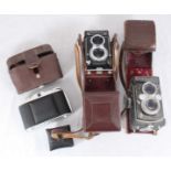 A Rolleiflex twin-lens SLR camera with brown protective case, together with Yashica 365 TLR camera