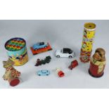 Russian wooden graduated dolls, pull-along cat, kaleidoscope, graduated tins and toy cars etc.