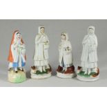 Four early 19th century Staffordshire red riding hood figures, including two pearlware examples
