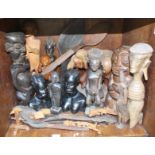 a collection of African and Asian carved wooden figures